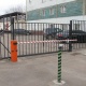 Металлическая решетка ограды заводской территории, откатные ворота со шлагбаумом и калитка с системой допуска.